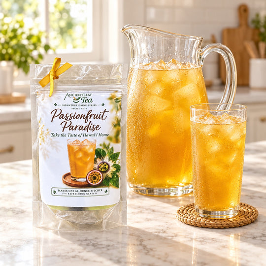 Passionfruit Paradise drink kit with a pitcher and glass of iced passionfruit tea